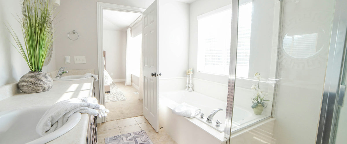 Bright bathroom with bathtub and vanity