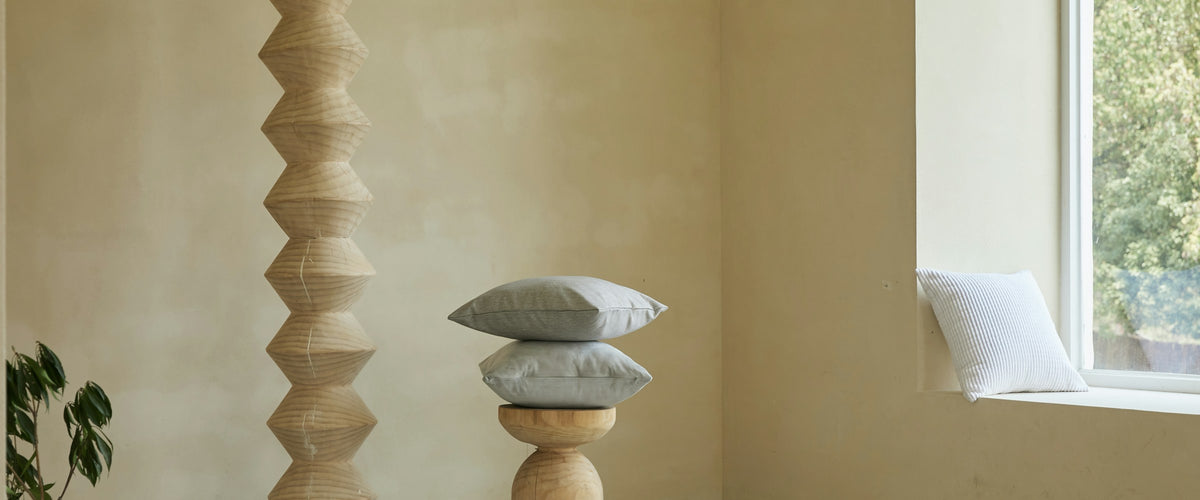 Minimal sculptural decor pieces in a sunlit room
