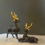 black and golden deer figurine 