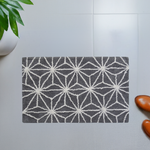 grey bath rug with geometric pattern