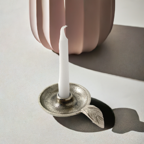 taper candle holder for lighting the candle 